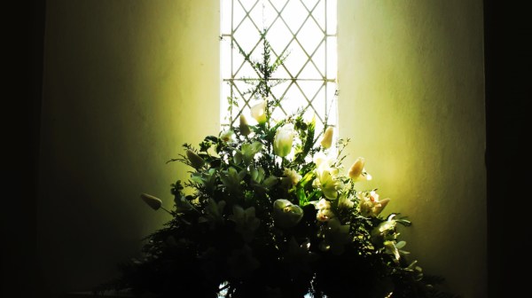 Flowers in church window cropped