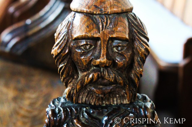 wooden pew end man